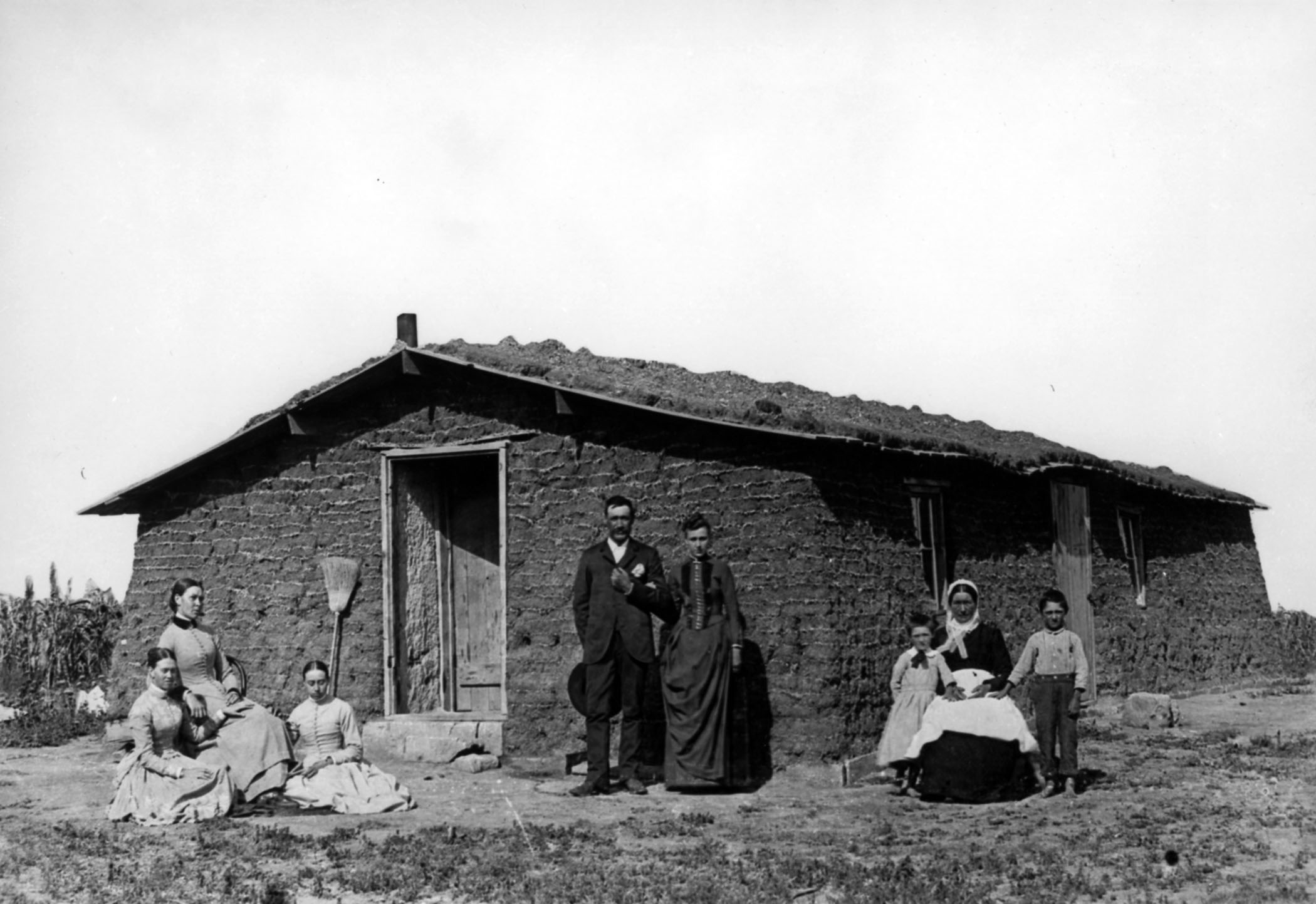 Photo of a pioneer family and sod house in the 1890s. Forbes #73