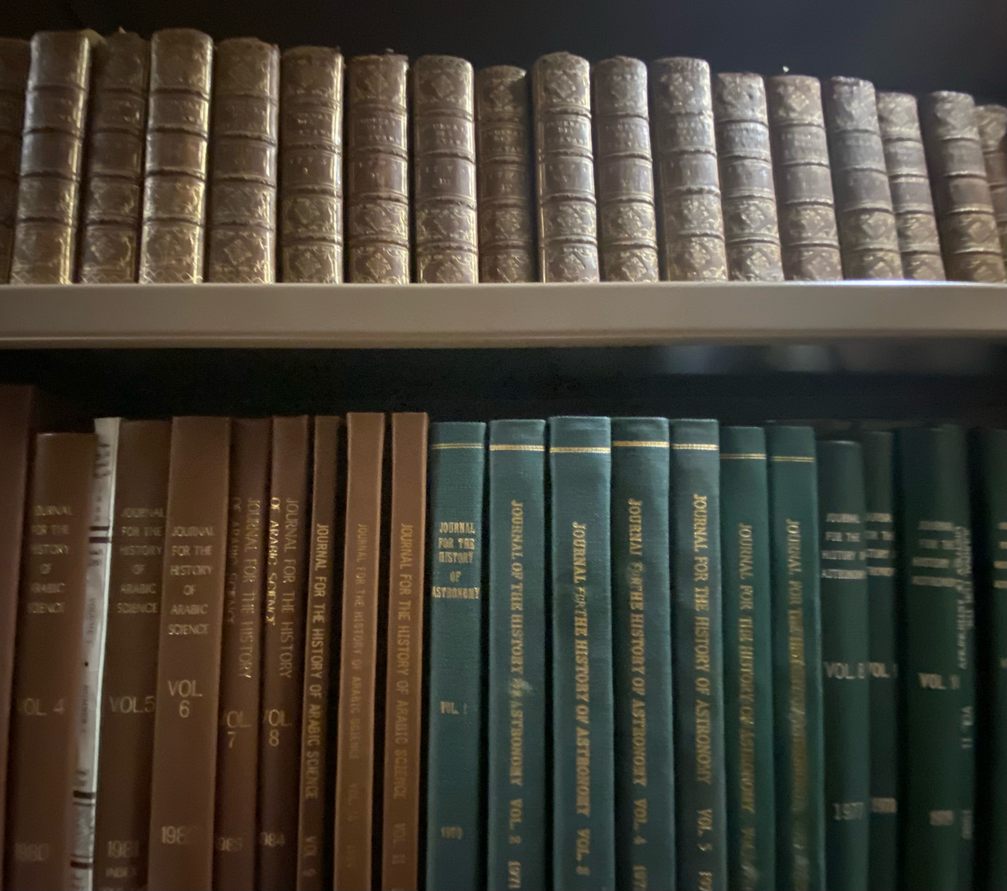 Photo of two shelves of books (smaller French periodicals & recent journals in topic areas of Arabic sciences and history of astronomy