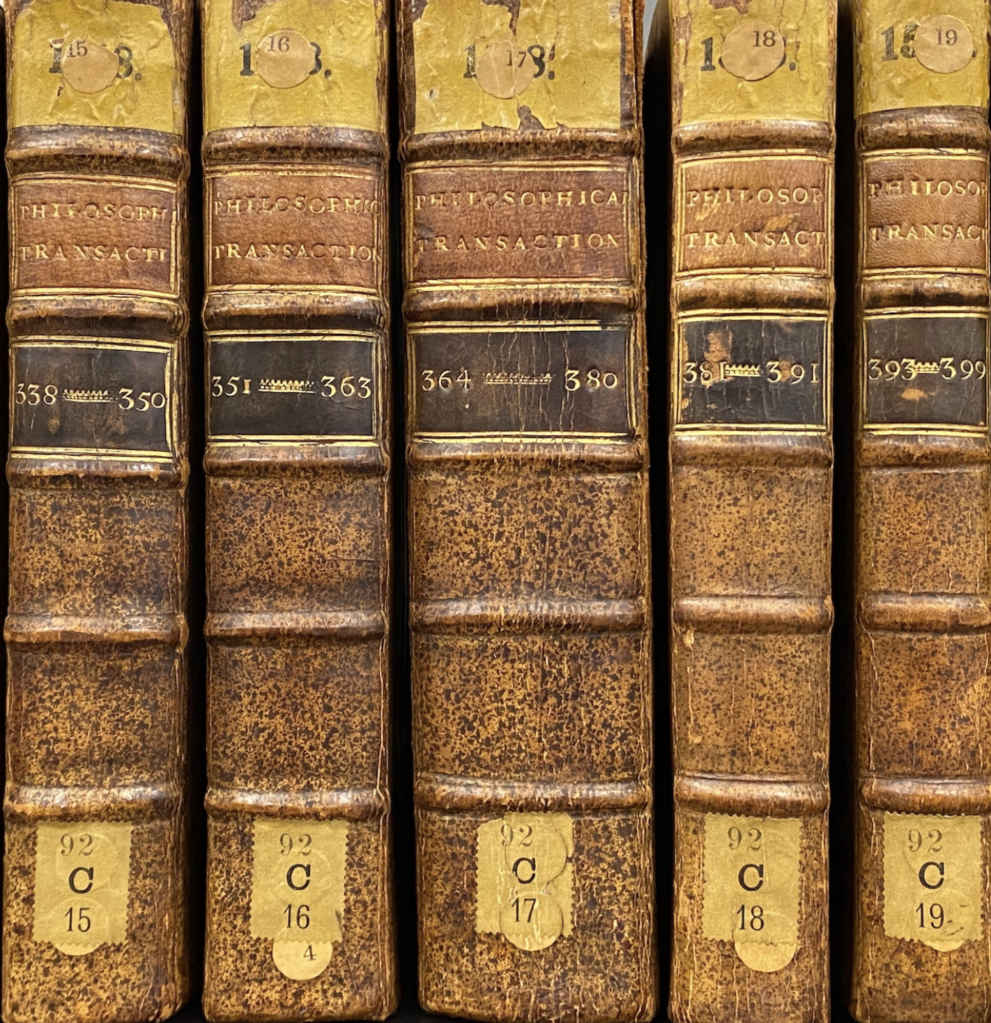 Photo of spines of 5 volumes of the Philosophical Transactions 