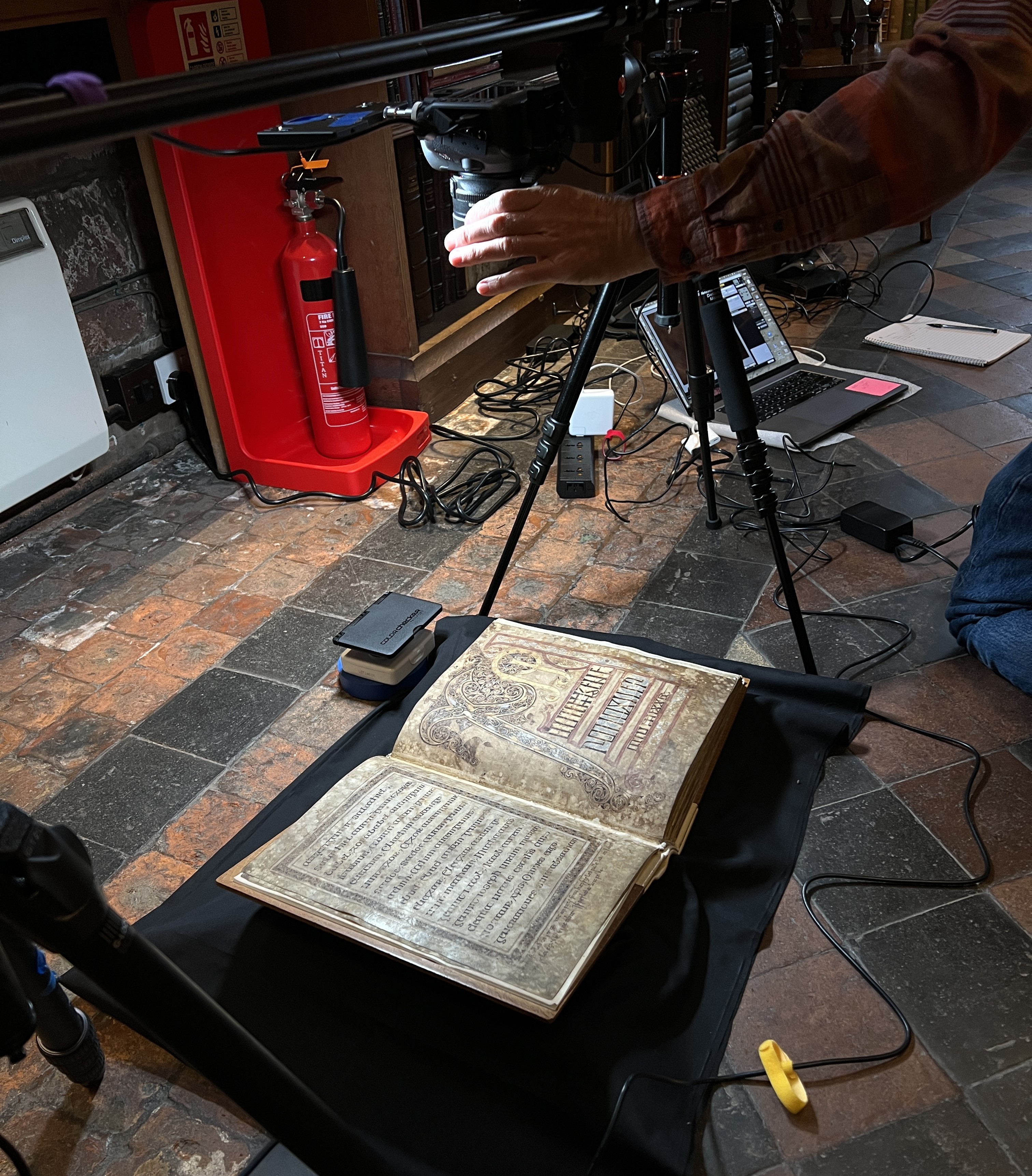 Focusing a camera lens over head pages from the St. Chad Gospels