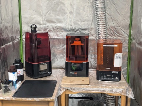 An image of 2 resin 3D printers and the wash/cure station.