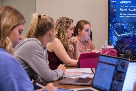 Image of four students in classroom