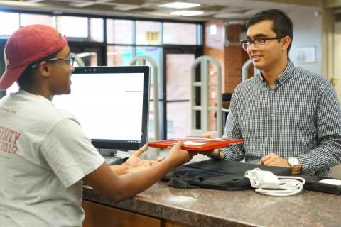 A man borrowing a laptop